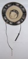 Lot 750 - A sombrero, black and cream with silver...