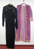 Lot 751 - A black velvet housecoat with applied studded...