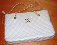 Lot 775 - A Coco Chanel white leather vintage handbag...
