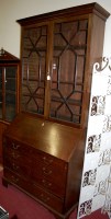 Lot 1159 - A George III mahogany bureau bookcase, the...