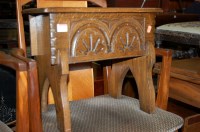 Lot 1186 - A moulded oak hinged top stool, w.45cm