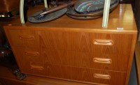 Lot 1191 - A 1970s G-Plan teak low four-door side...