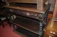 Lot 1202 - A late 19th century heavily carved oak...