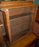 Lot 1203 - A circa 1900 line carved oak ledgeback open...