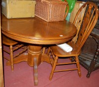 Lot 1209 - A contemporary oak dining suite, comprising...