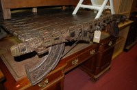 Lot 1220 - An Indonesian stained hardwood, iron and...