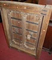 Lot 1230 - An Indonesian teak and metal bound window...