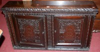 Lot 1235 - An antique low relief carved oak double door...