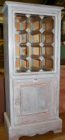 Lot 1250 - A contemporary limed pine freestanding open...