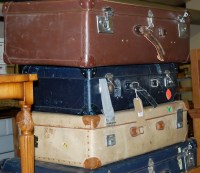 Lot 1252 - A collection of six various suitcases;...