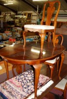 Lot 1258 - A contemporary walnut dining suite comprising...