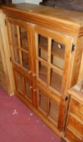 Lot 1331 - A contemporary pine four door glazed display...