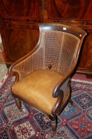 Lot 1345 - A William IV mahogany bar back tub Bergere...