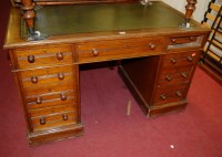 Lot 1355 - An Edwardian oak and gilt tooled green leather...