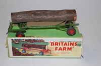 Lot 1570 - A Britains Farm No.129F log timber trailer, in...