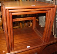 Lot 1402 - A G-Plan teak nest of three occasional tables,...