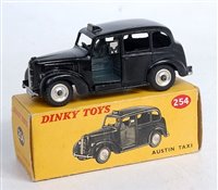 Lot 1961 - A Dinky Toys No.254 Austin Taxi, comprising...