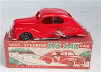 Lot 3311 - A plastic and clockwork self-steering Zig-Zag...
