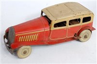 Lot 3285 - A Mettoy tinplate and clockwork orange and...