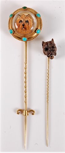 Lot 2528 - Two stick dog stick pins: a reverse painted...