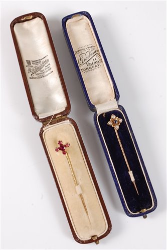 Lot 2540 - Two gemset stick pins: a raspberry pink...
