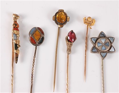 Lot 2543 - Six gemset stick pins: a multi gemset dirk...