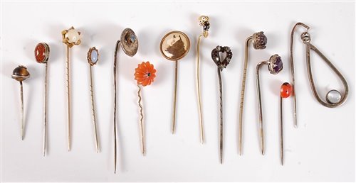 Lot 2561 - Thirteen assorted stick pins: to include...