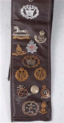 Lot 229 - A German Waffen SS eagle cap badge, together with a skull example. (2)