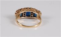 Lot 2593 - An 18ct sapphire and diamond ring, the central...