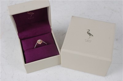 Lot 1173 - A platinum and 18ct rose gold pear shaped...
