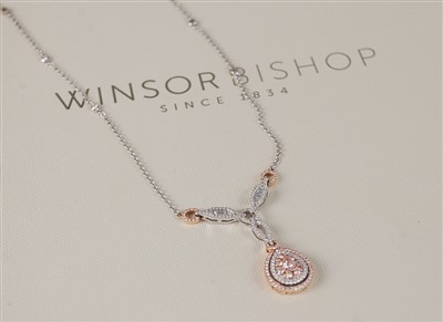 Lot 1172 - An 18ct white and rose gold fancy pear shaped...