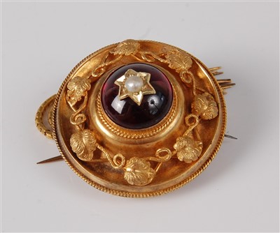 Lot 1177 - A late Victorian yellow metal garnet set...