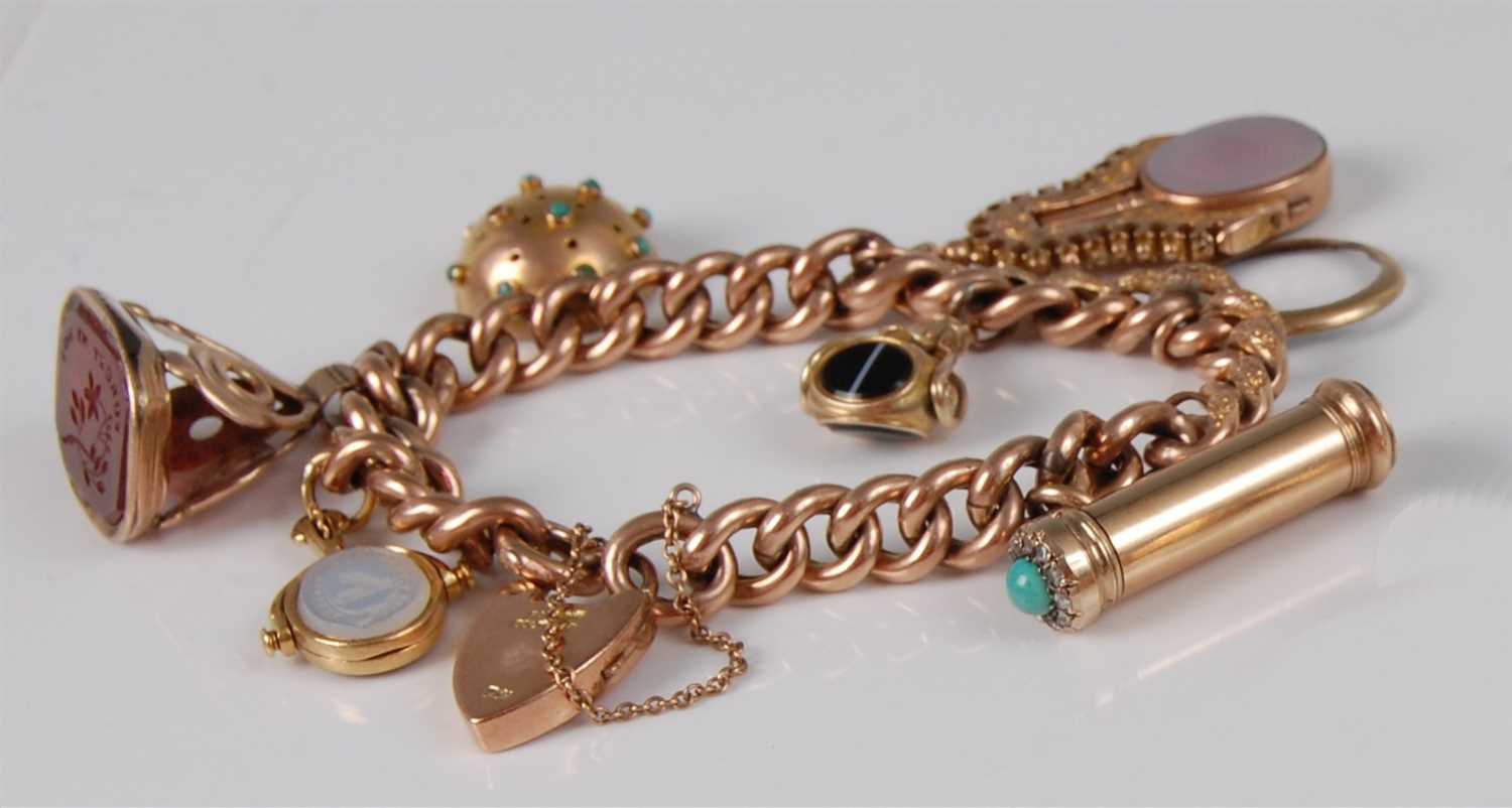 Lot 1178 - A 9ct gold curblink bracelet, containing a...