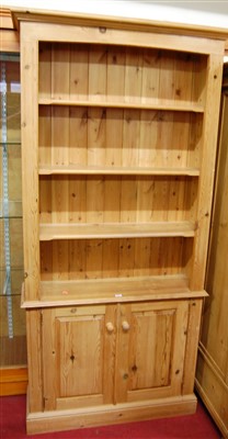 Lot 1167 - A modern pine freestanding open bookshelf,...