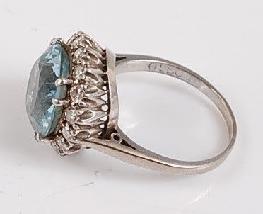 Lot 1183 - A white metal, aquamarine and diamond circular...