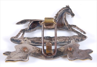 Lot 24 - A West Yorkshire Regiment Officer's white metal and gilt cap badge
