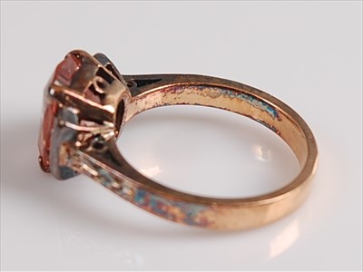 Lot 2129 - A yellow and white metal, pink sapphire and...