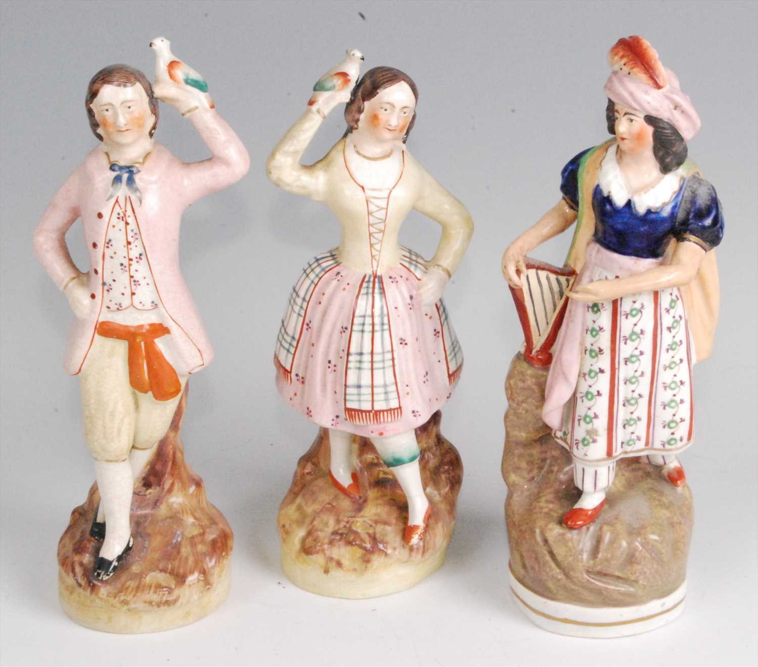 Lot 1115 - A pair of 19th century Staffordshire pearlware...