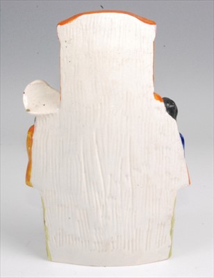 Lot 1124 - A 19th century Staffordshire flatback figure...