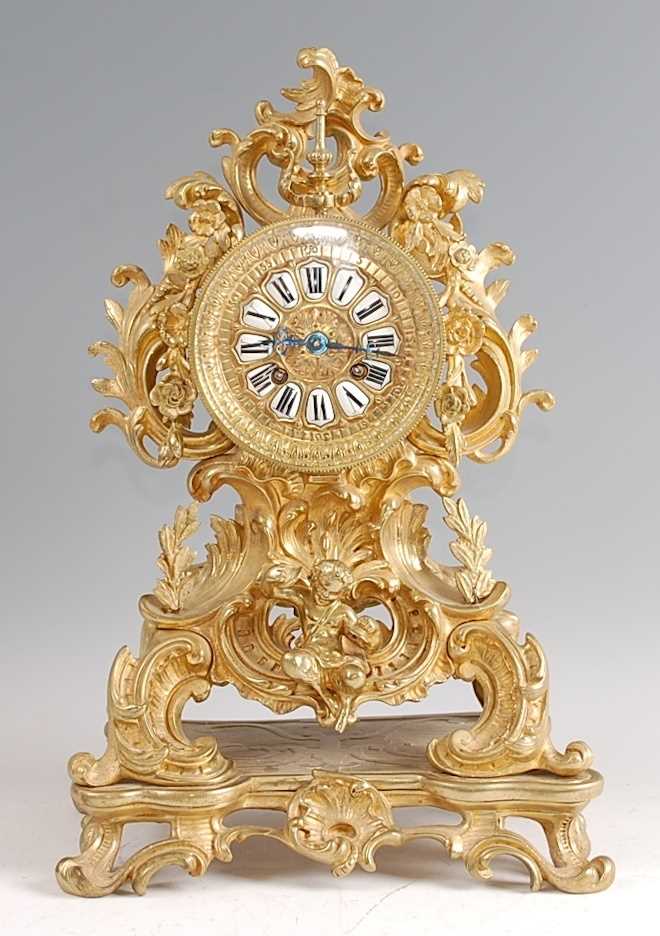 Lot 3 - A Rococo Revival gilt brass mantel clock, the...