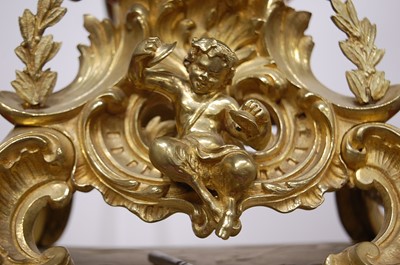 Lot 3 - A Rococo Revival gilt brass mantel clock, the...