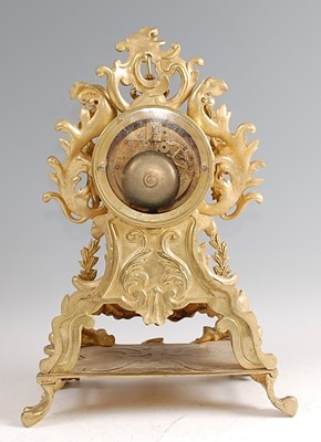 Lot 3 - A Rococo Revival gilt brass mantel clock, the...