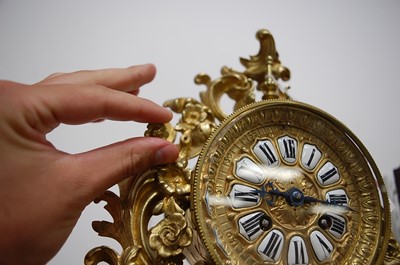 Lot 3 - A Rococo Revival gilt brass mantel clock, the...