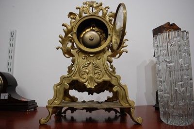 Lot 3 - A Rococo Revival gilt brass mantel clock, the...