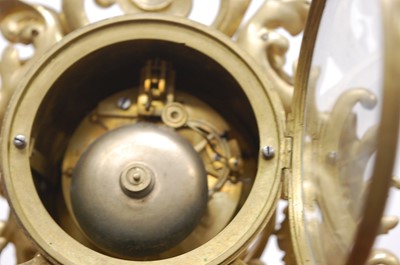 Lot 3 - A Rococo Revival gilt brass mantel clock, the...