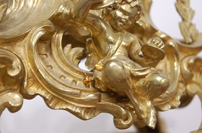 Lot 3 - A Rococo Revival gilt brass mantel clock, the...