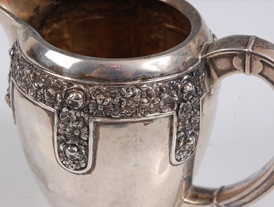 Lot 97 - An early 20th century German silver cream jug,...