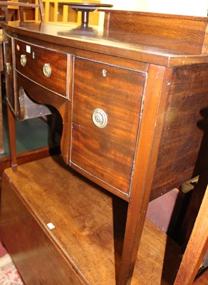 Lot 1428 - A 19th century mahogany bowfront kneehole...