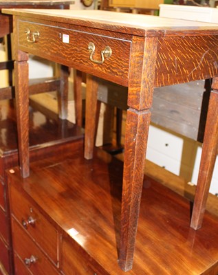 Lot 1449 - An early 20th century oak and rexine inset...