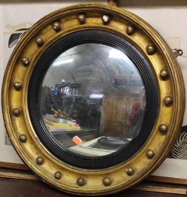 Lot 1046 - A gilt framed and ball applied convex wall...